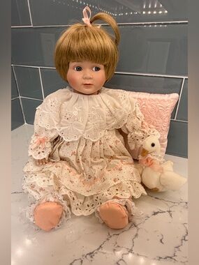 Porcelain Baby Doll by Susan Wakeen- in Cream and Pink Dress with Plush Duck